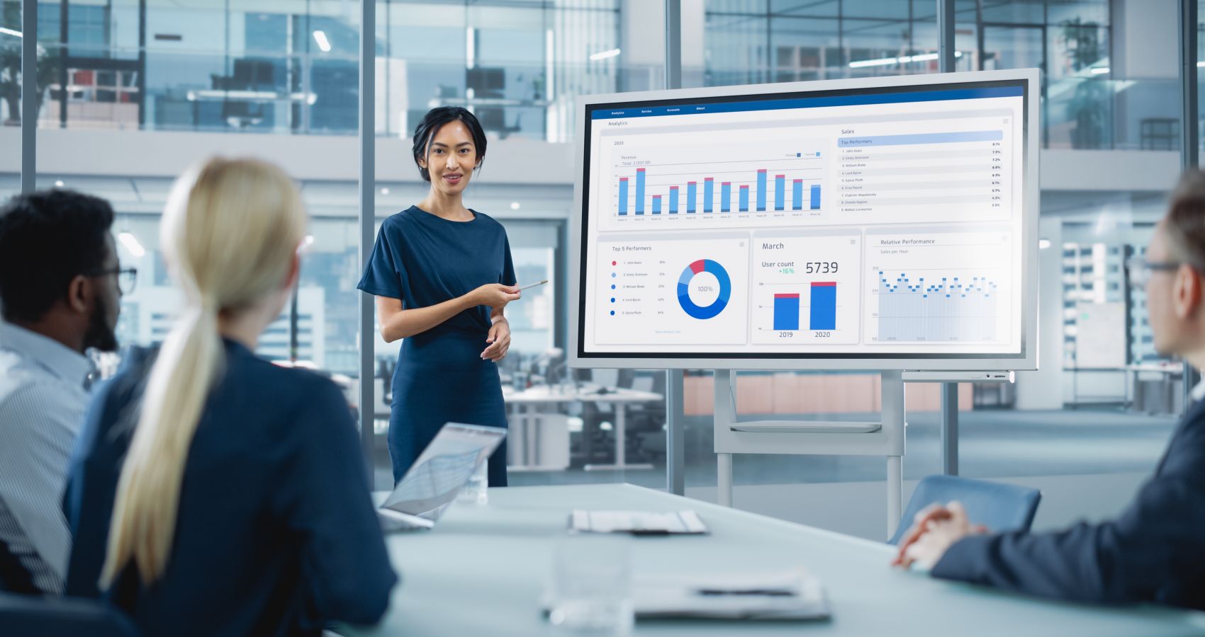 Female manager holds meeting presentation for senior stakeholders