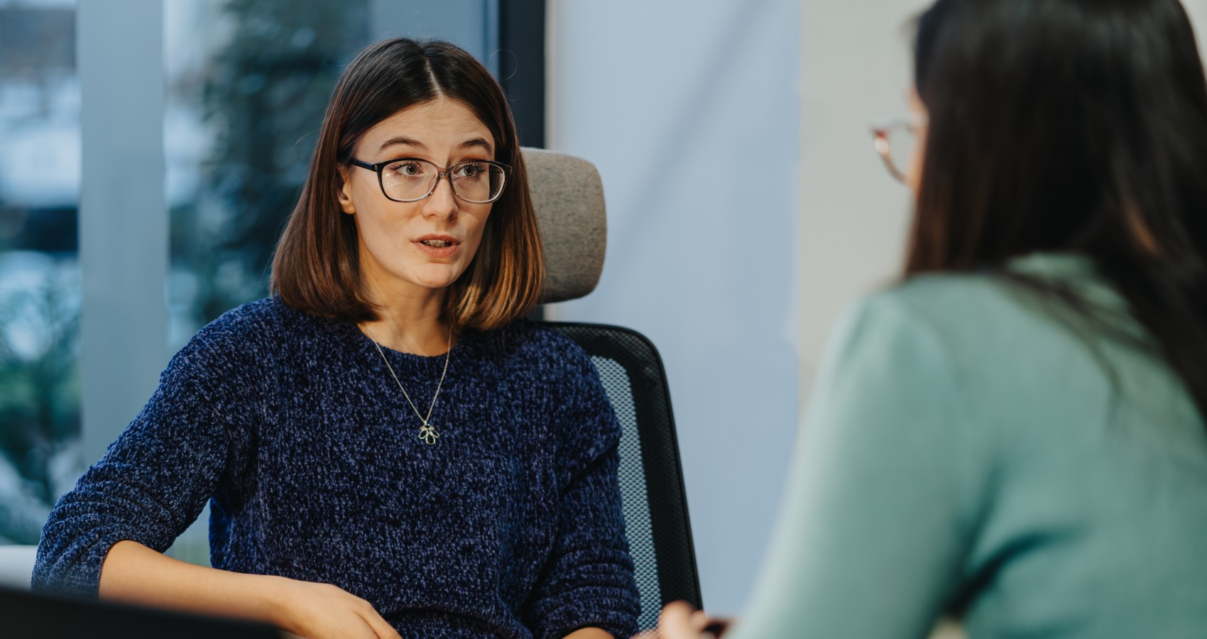 Professional women in a business discussion at office