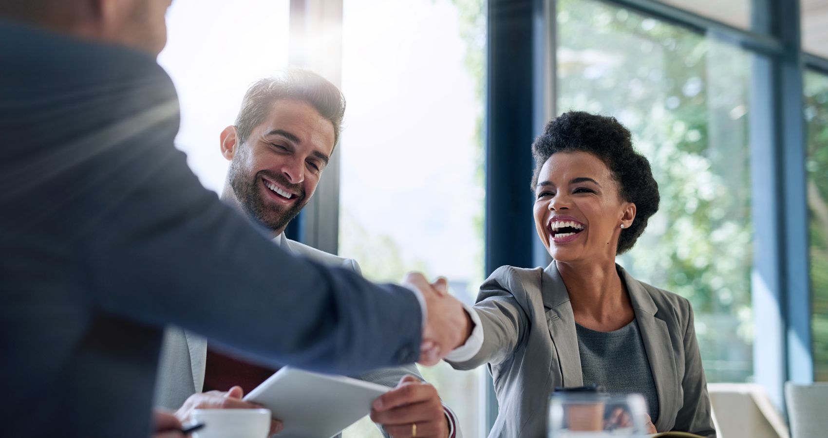 Business people shaking hands in meeting