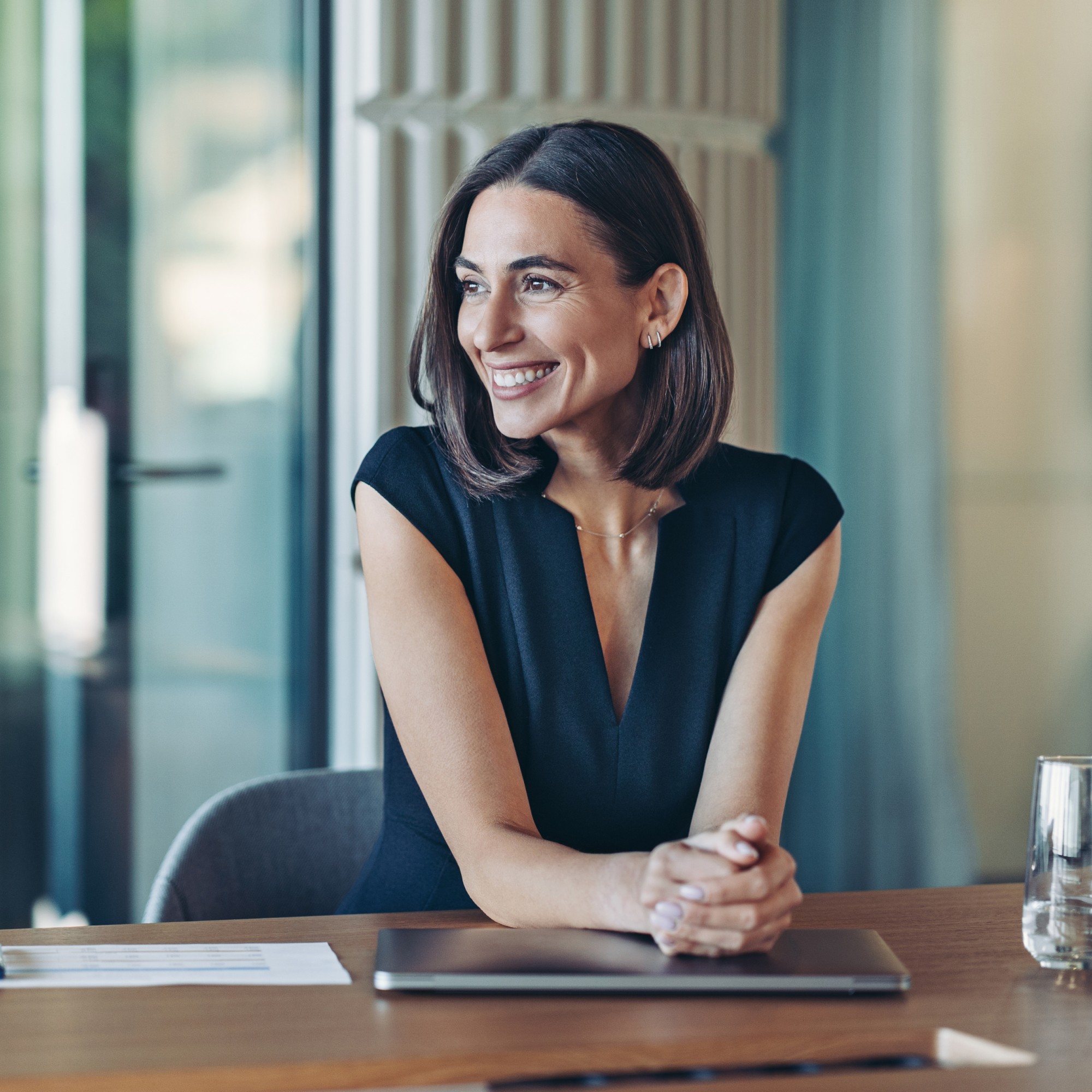 Smiling businesswoman sitting in the office